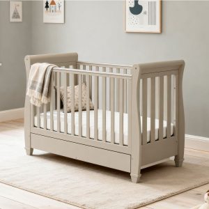 SLEEP TIME Babymore Eva Sleigh Cotbed in cashmere. colourway with curved ends and underbed drawer.